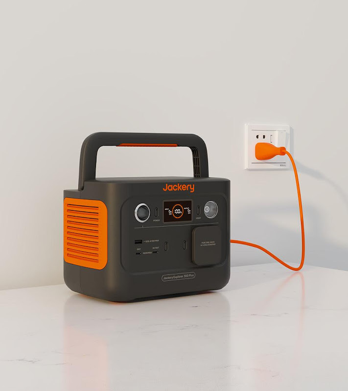 A black and orange portable radio

Description automatically generated