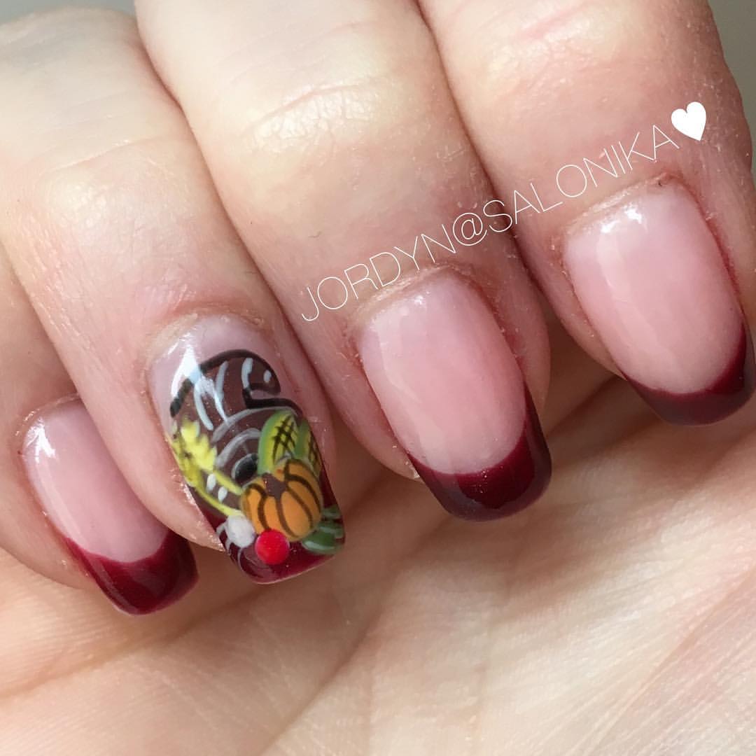 Close-up of hands with fall nail design having Cornucopia-Themed Manicures