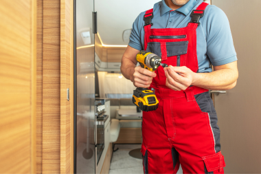questions to ask home addition contractors in michigan remodeler with drill in front of office custom built okemos