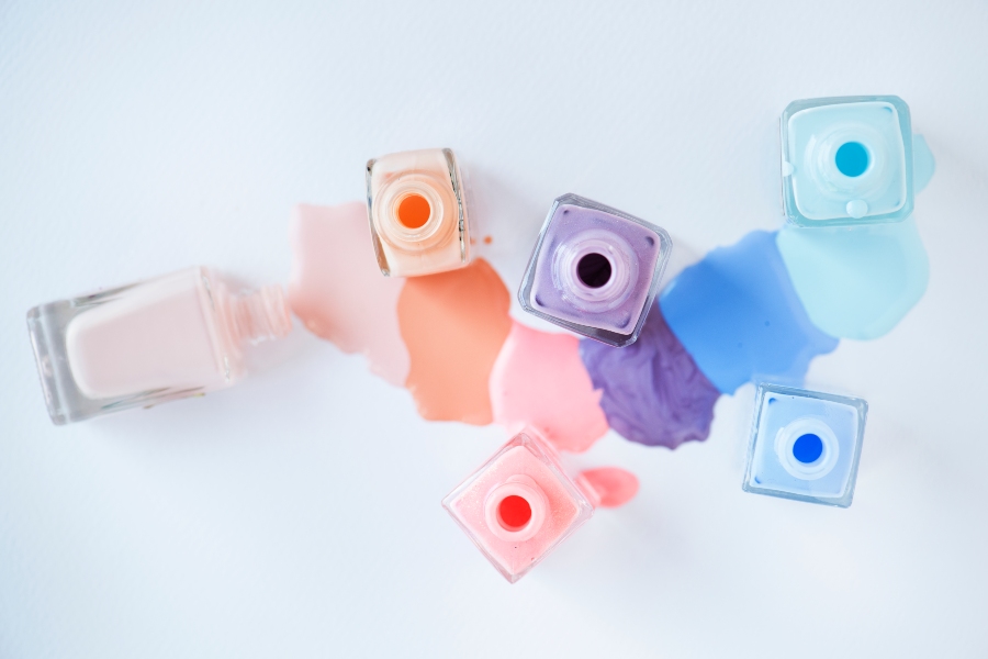 Pastel rainbow tips add soft, dreamy hues to a fresh French nail tip design.