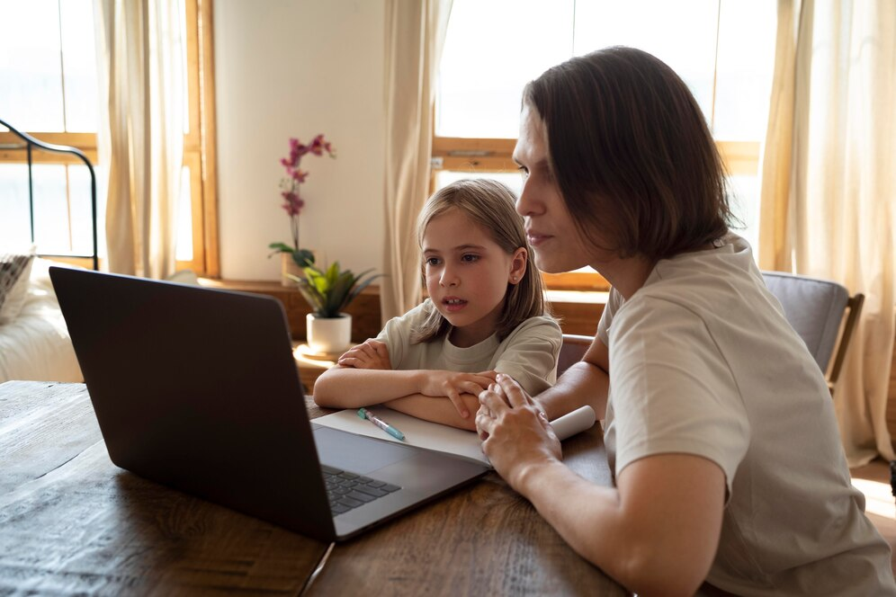 A mother and a child working on Laptop.