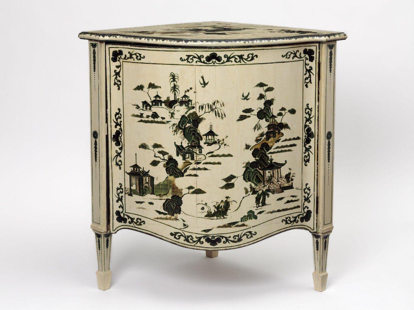 A white and black painted cabinet

Description automatically generated