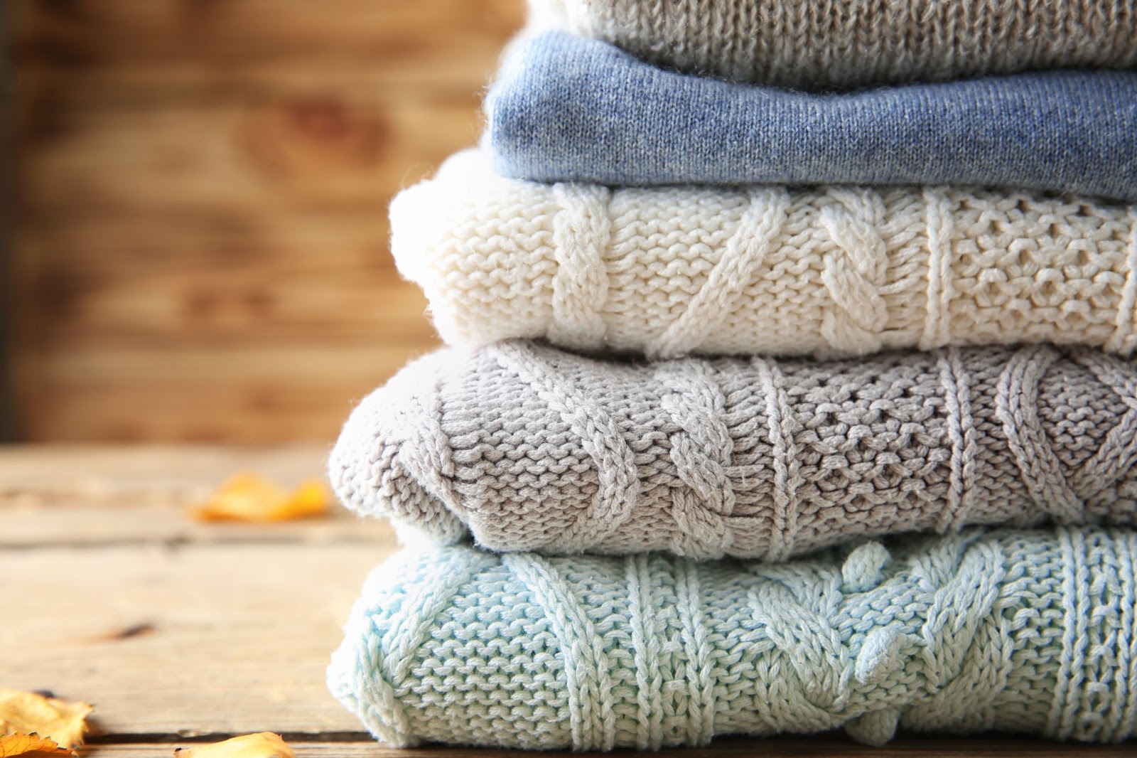 sweaters neatly stacked as a sweater storage idea