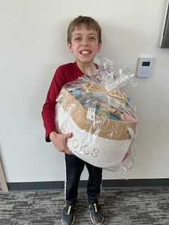 Caleb holding a prize