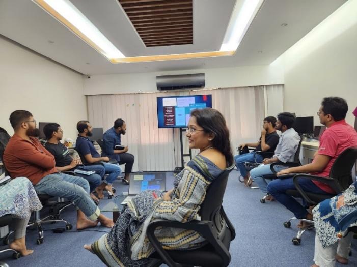 May be an image of 6 people, people smiling, people studying, newsroom and text