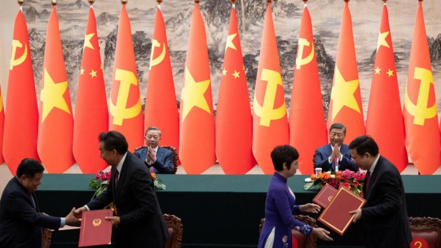 Chinese President Xi Jinping and Vietnam's President To Lam applaud during a signing ceremony at the Great Hall of the People in Beijing, China, 19 August 2024.