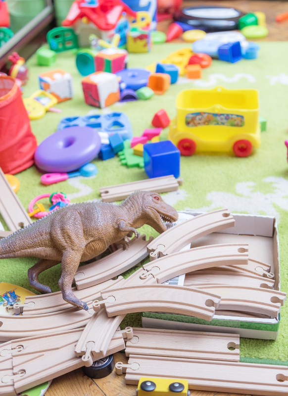 scattered toys on floor one reason you should take time to pack up your speech room