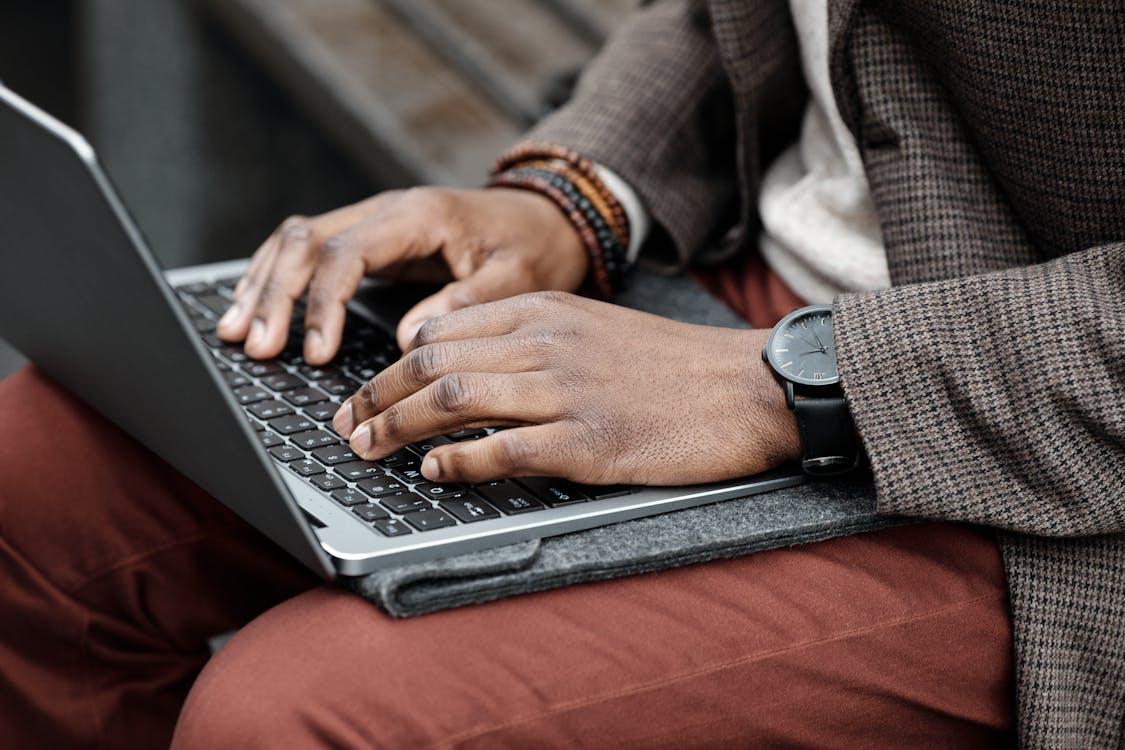 Free Close Up Photo of Person Using a Laptop Stock Photo