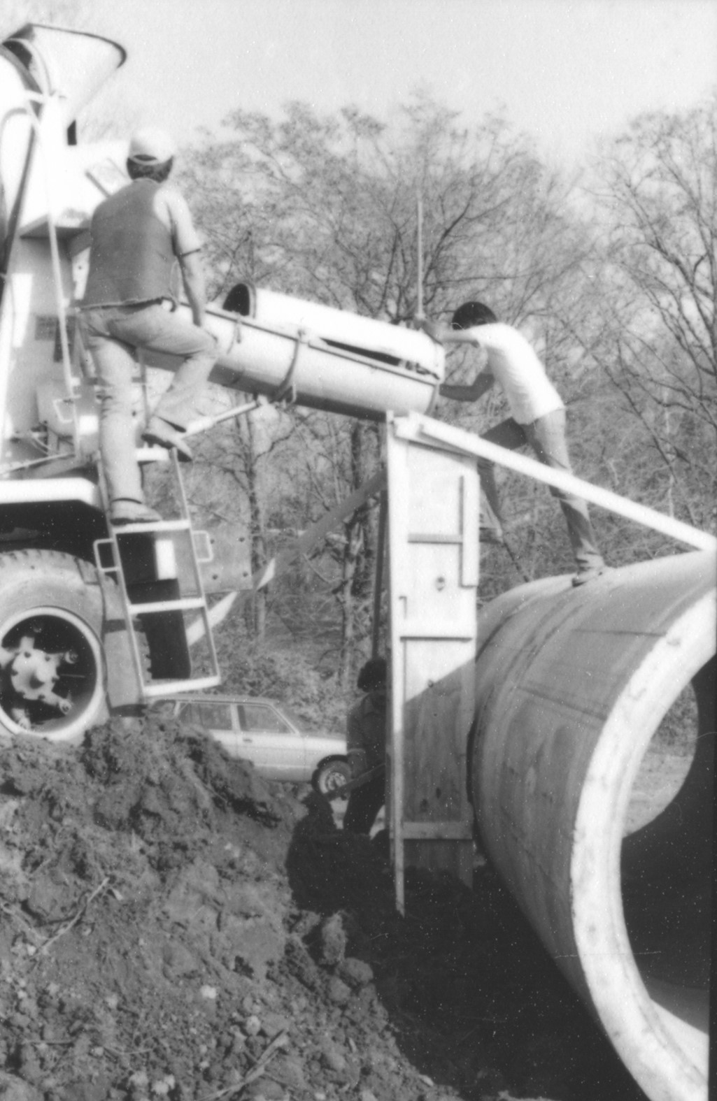 Image of the pipe portion of the sculpture during installation - Concrete forms for support of North-West pipe poured