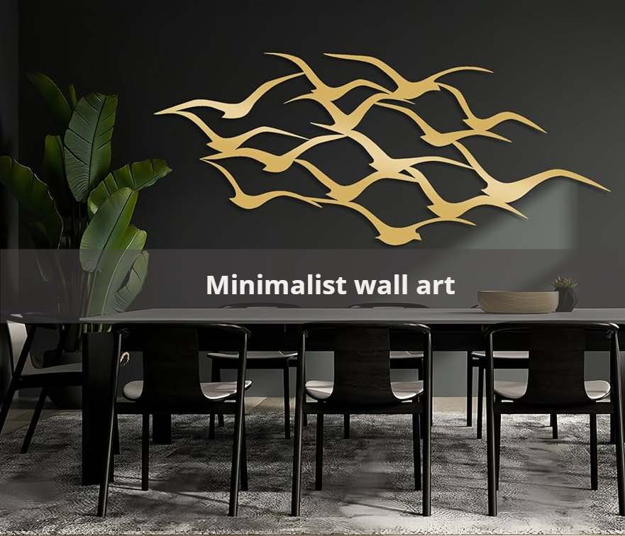 A dining room with black wall and brown wall art