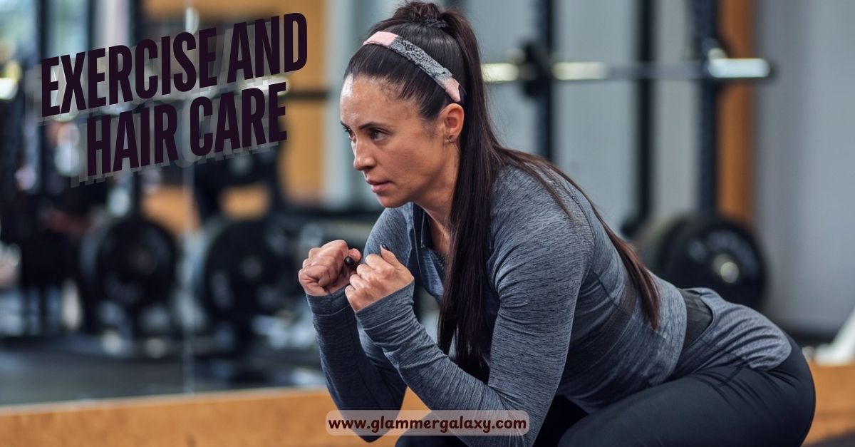 Woman in gym gear squatting, hairband on, blurred gym equipment background.