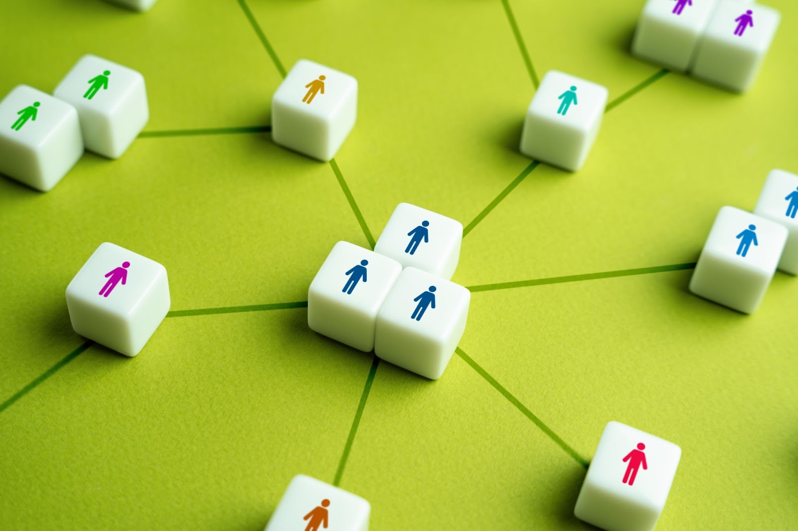 People with tiles with interconnected lines. 