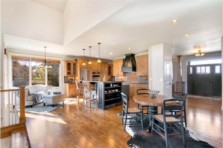 An open layout view showing the living room, kitchen, breakfast area, and kitchen.