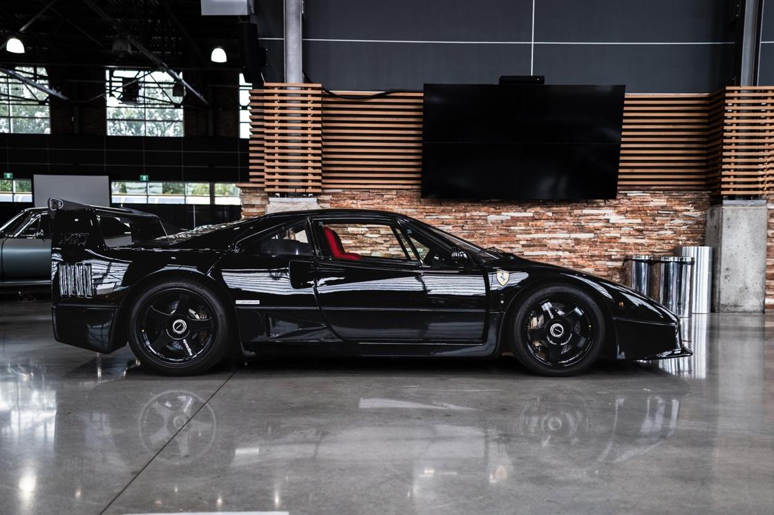 A black sports car in a room

AI-generated content may be incorrect.