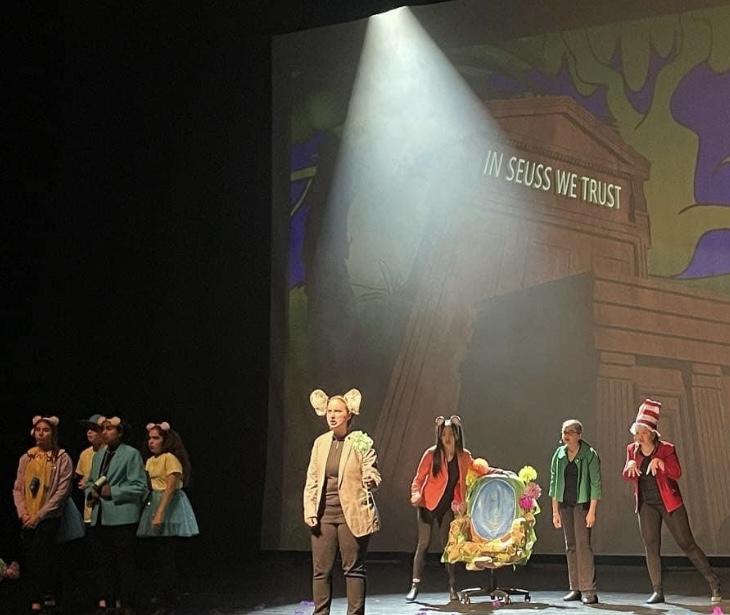 A group of people on a stage

Description automatically generated