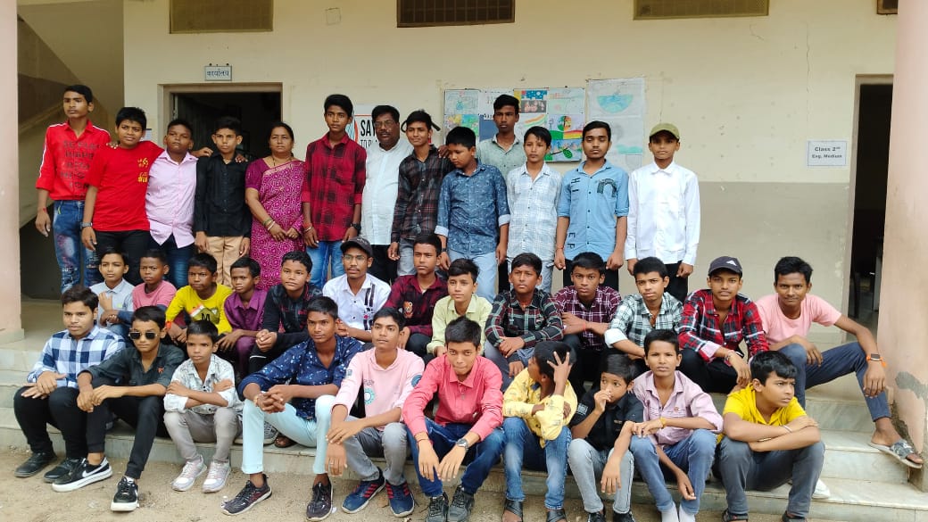 Students at Yusuf Meherally Centre posing for a picture with the management out there