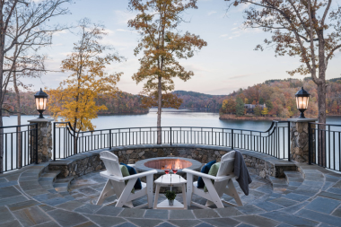 modernizing your walloon lake home must have features lakeside fire pit area with metal railings custom built michigan