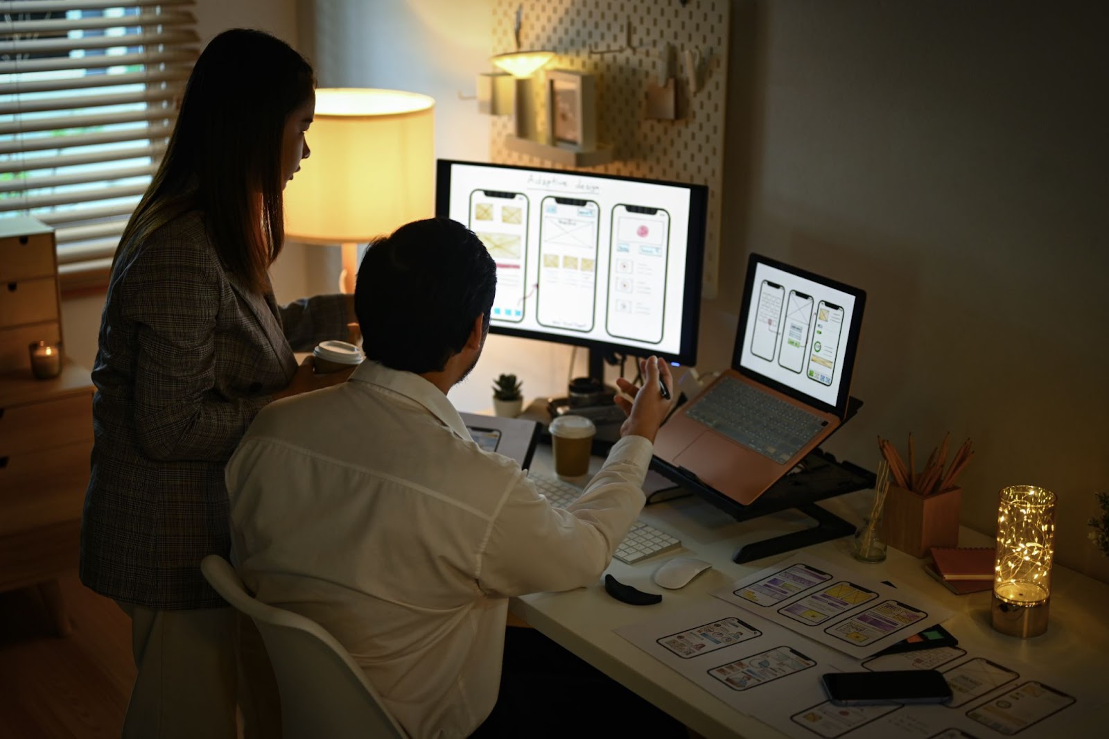 A designer reviewing a user-friendly software interface, a key part of cognitive ergonomics.