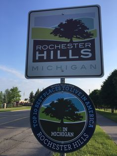 Signs for Rochester Hills Michigan. Sign reading "Top 10 Best Places to Live in America" and "#1 in Michigan"