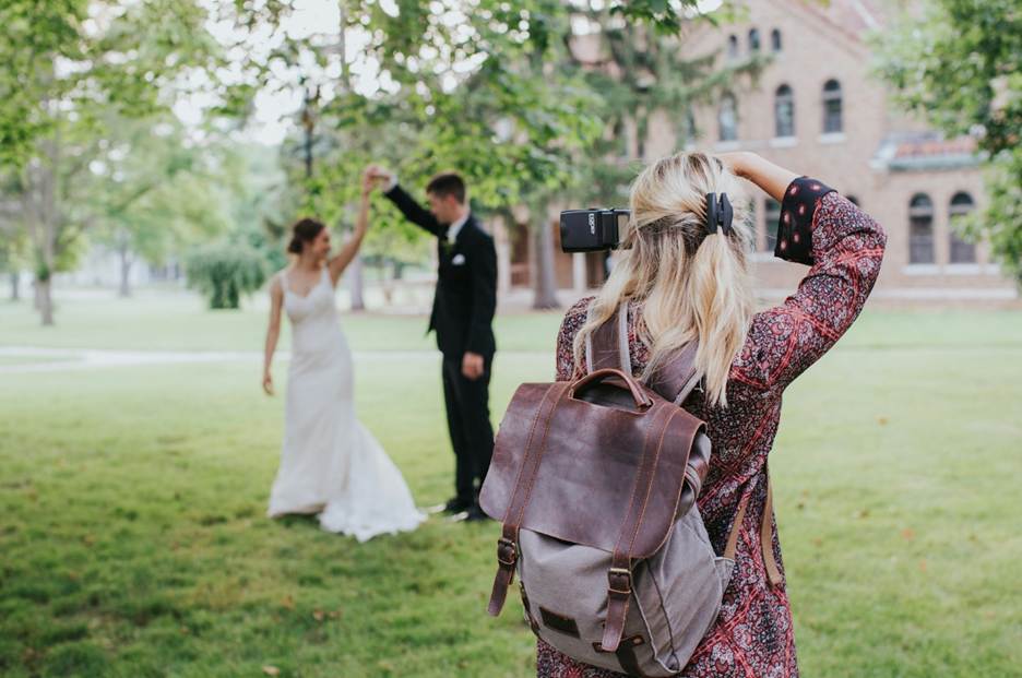 https://unsplash.com/photos/woman-in-red-and-black-floral-dress-carrying-black-leather-shoulder-bag-ayc1G5wV3aA
