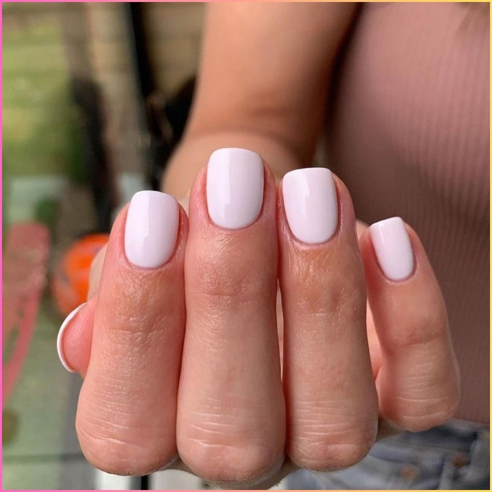 Close up of nails with simple pink nail designs having Pastel Pink Nails