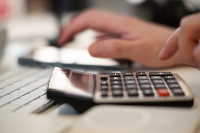 person using a calculator