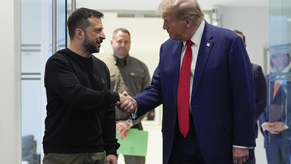 FILE - Republican presidential nominee former President Donald Trump, right, and Ukraine's President Volodymyr Zelenskyy shake hands during their meeting at Trump Tower, on Sept. 27, 2024, in New York