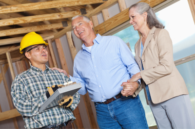 how to prepare your home for a remodeling project homeowners and contractor discussing remodel custom built michigan