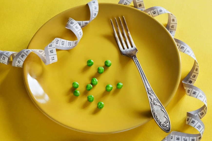 plate with measuring tape and fork
