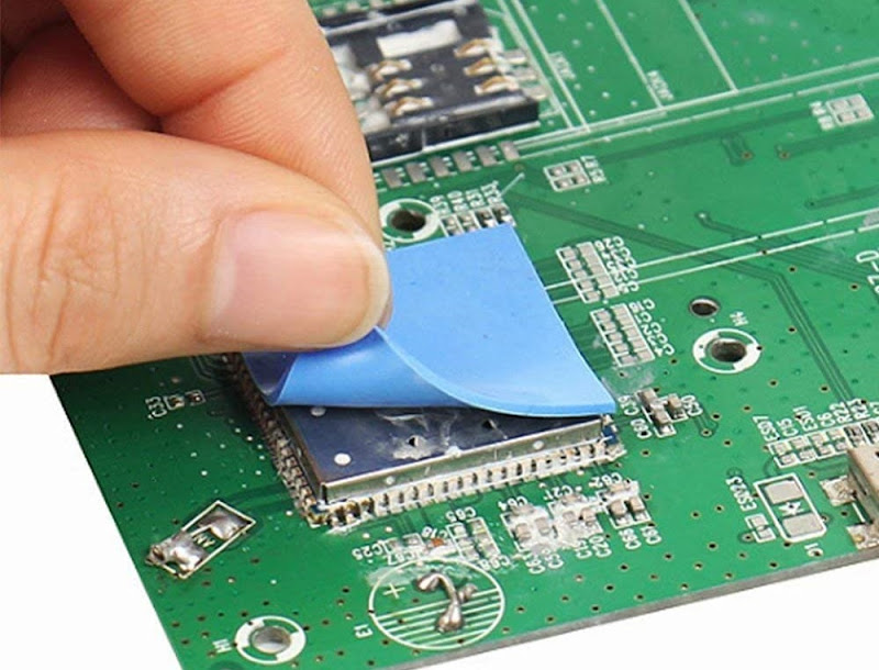 Bonding blue thermal pads to the motherboard
