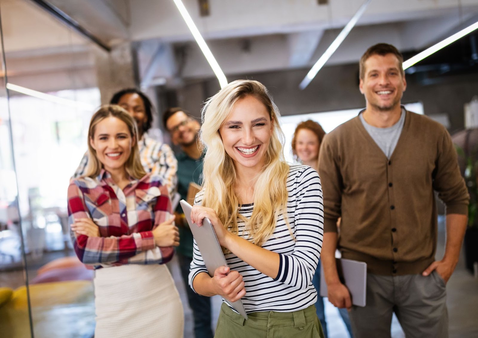 happy employees in a well lit office