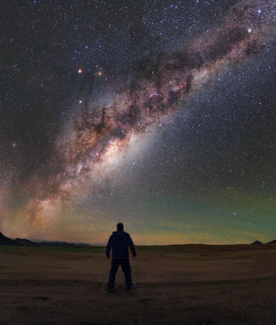A person looking at the stars in the sky

Description automatically generated with medium confidence