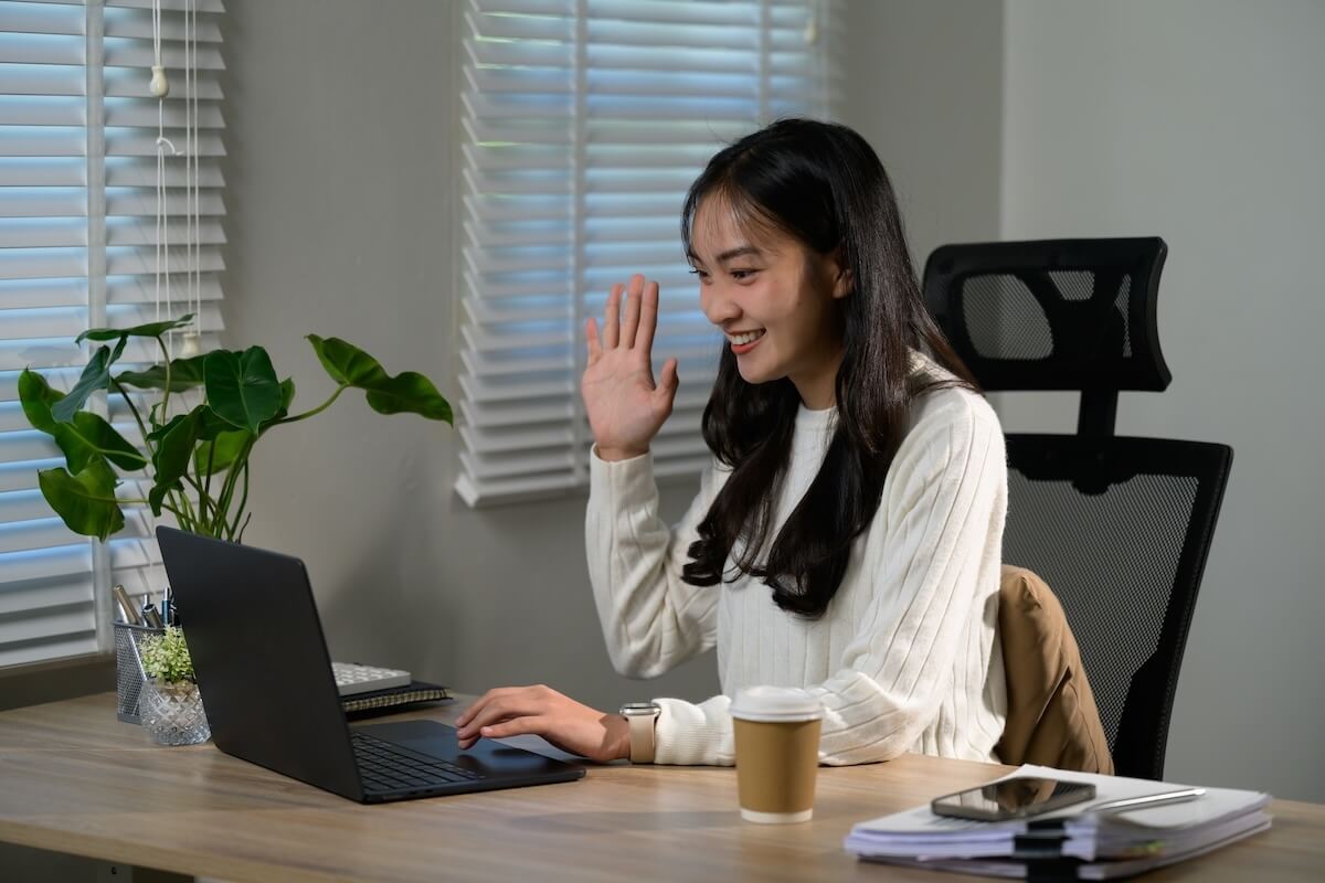 Leave of absence policy: employee using her laptop for a video call