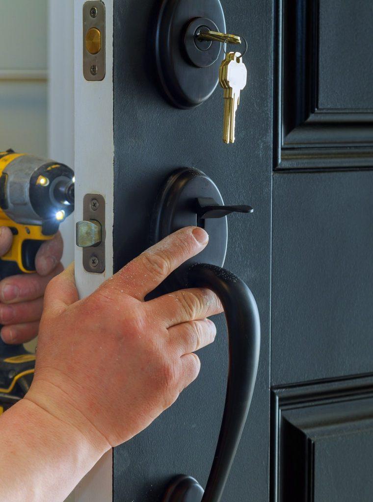 C:\Users\ADMIN\Desktop\locksmith\closeup-of-a-professional-locksmith-installing-a-new-lock-on-a-house-exterior-door-with-the-inside-qfsghwi6x1b2lvvh9x3mrj9yqw2he33ulcw18n4gzk.jpg