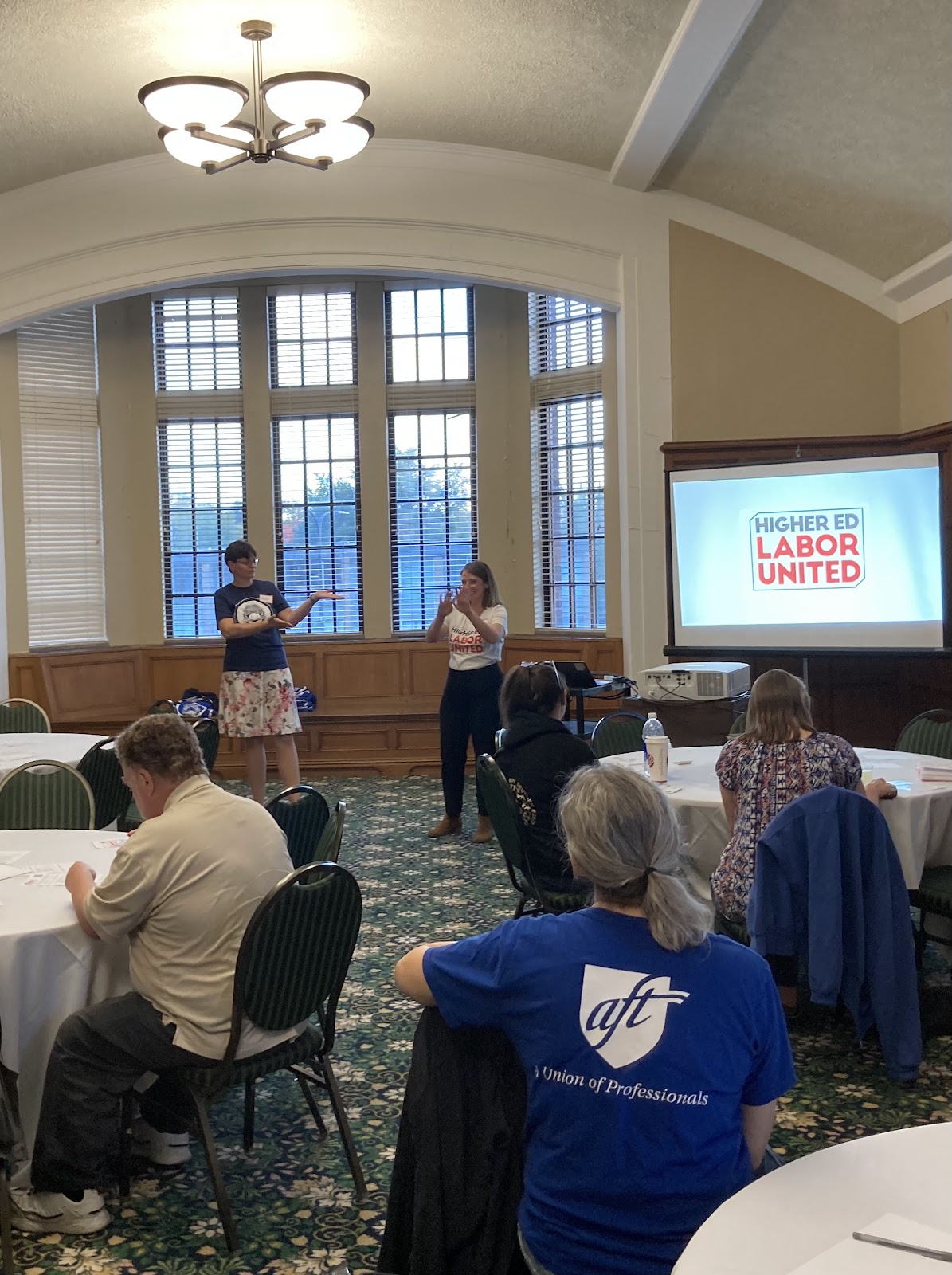 Anke Wolbert (EMUFT + HELU SC) introduces HELU chair, Mia McIver, at Eastern Michigan University on October 22.