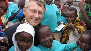 A person smiling with children