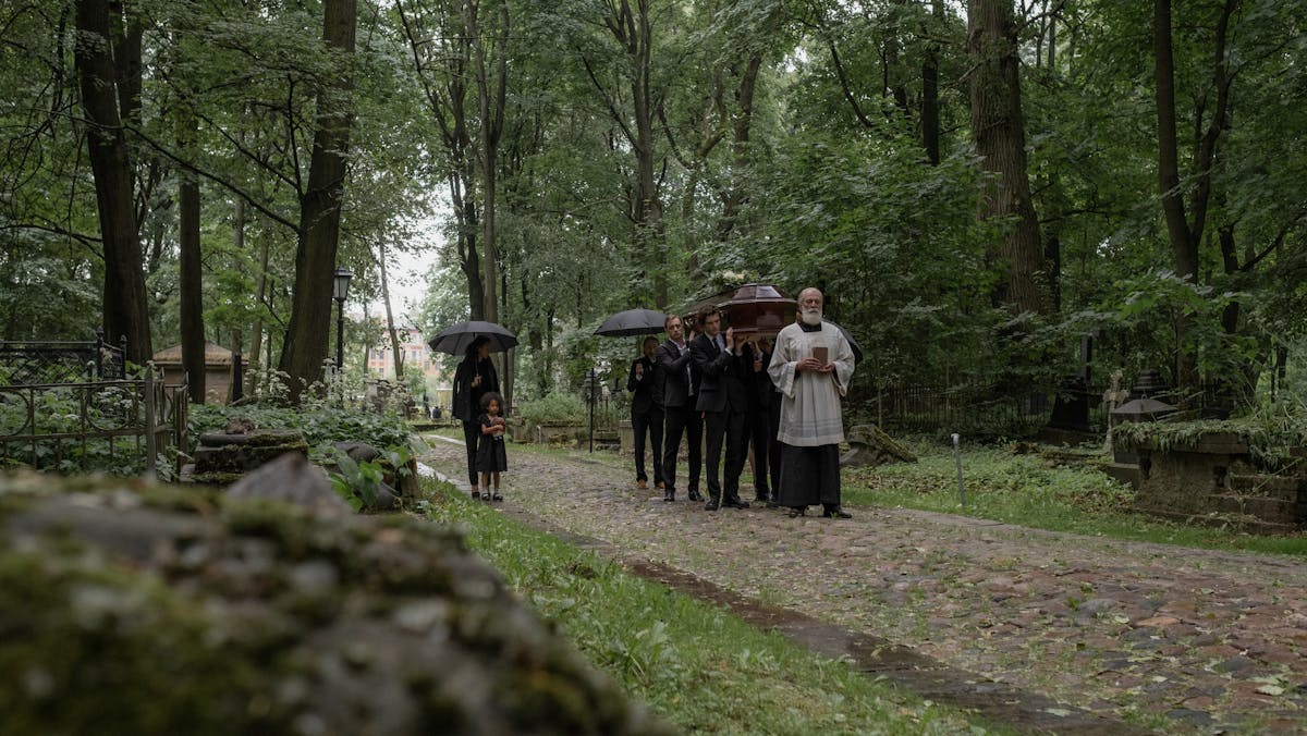 a religious person taking the lead in a funeral walk