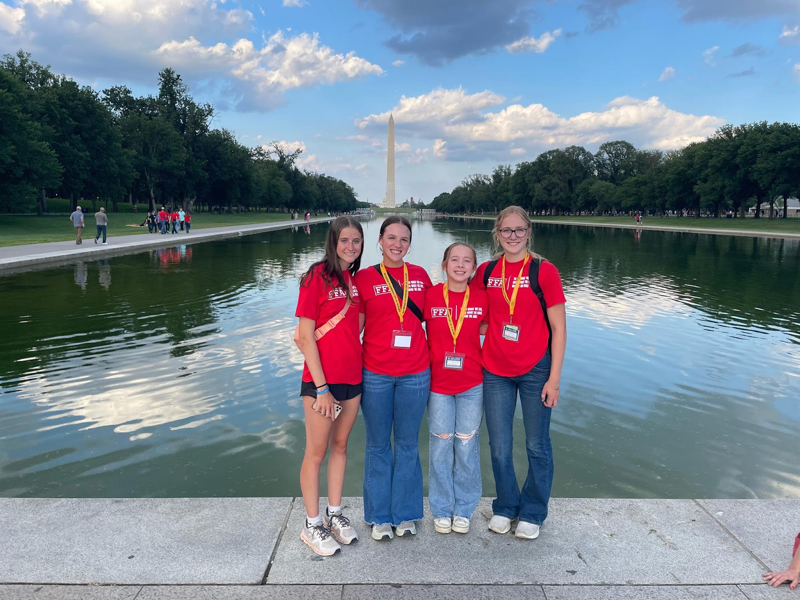 May be an image of 8 people and monument