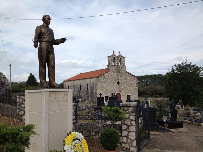 A statue of a person in front of a stone building AI-generated content may be incorrect.