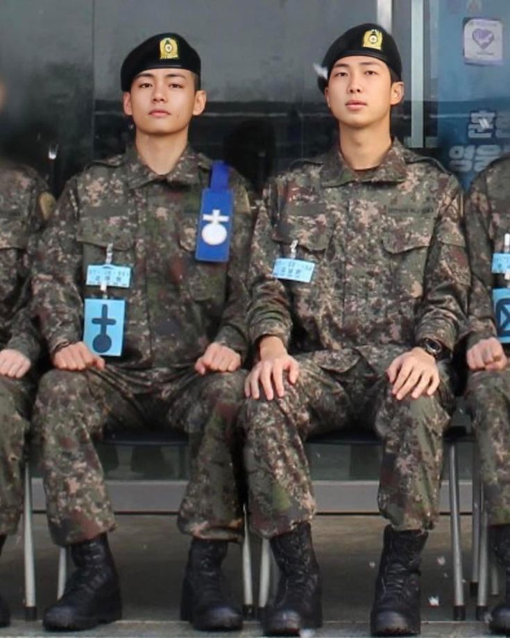 A photo of RM and V in their military uniform 