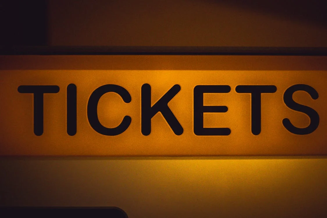 Photo by Patrick  : https://www.pexels.com/photo/tickets-text-on-yellow-wall-17527817/ 