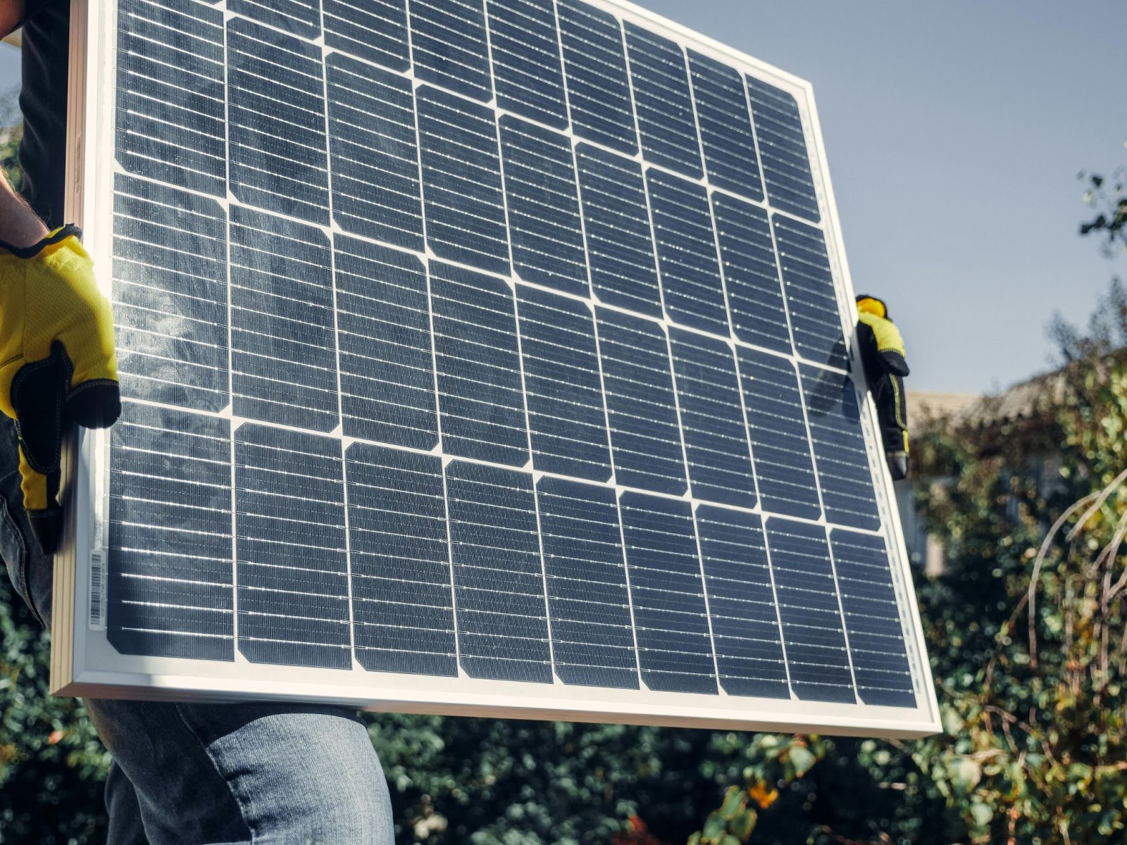 a man holding a solar panel