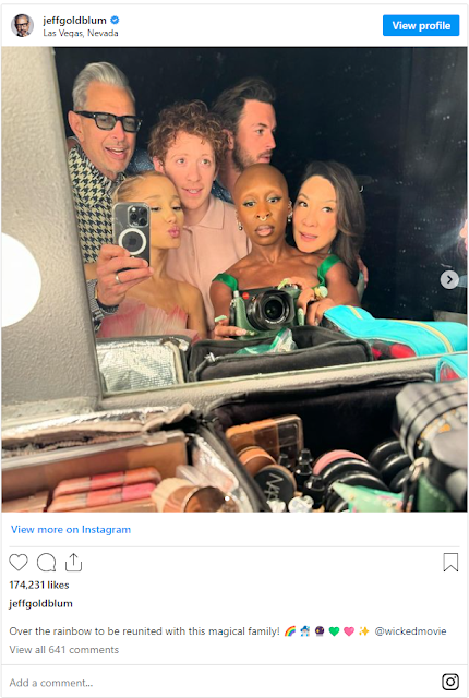 A group of people taking a selfie

Description automatically generated