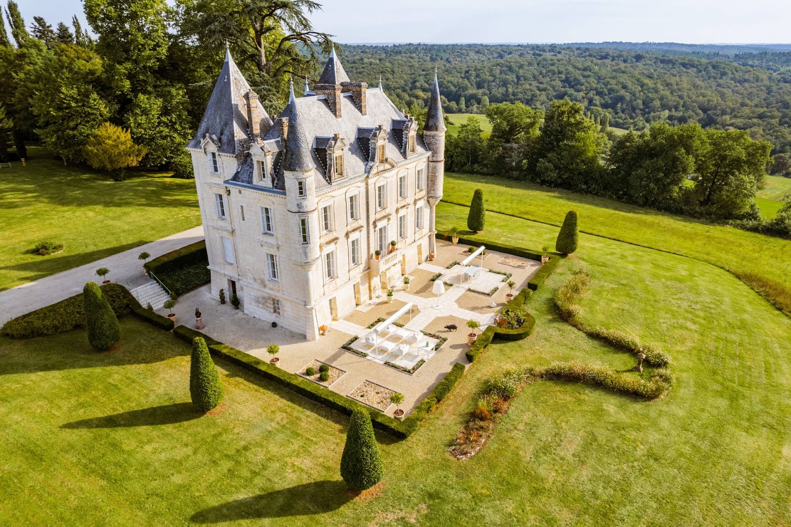 holiday villa: Front view of Château de Lasfonds featuring its grand stone façade