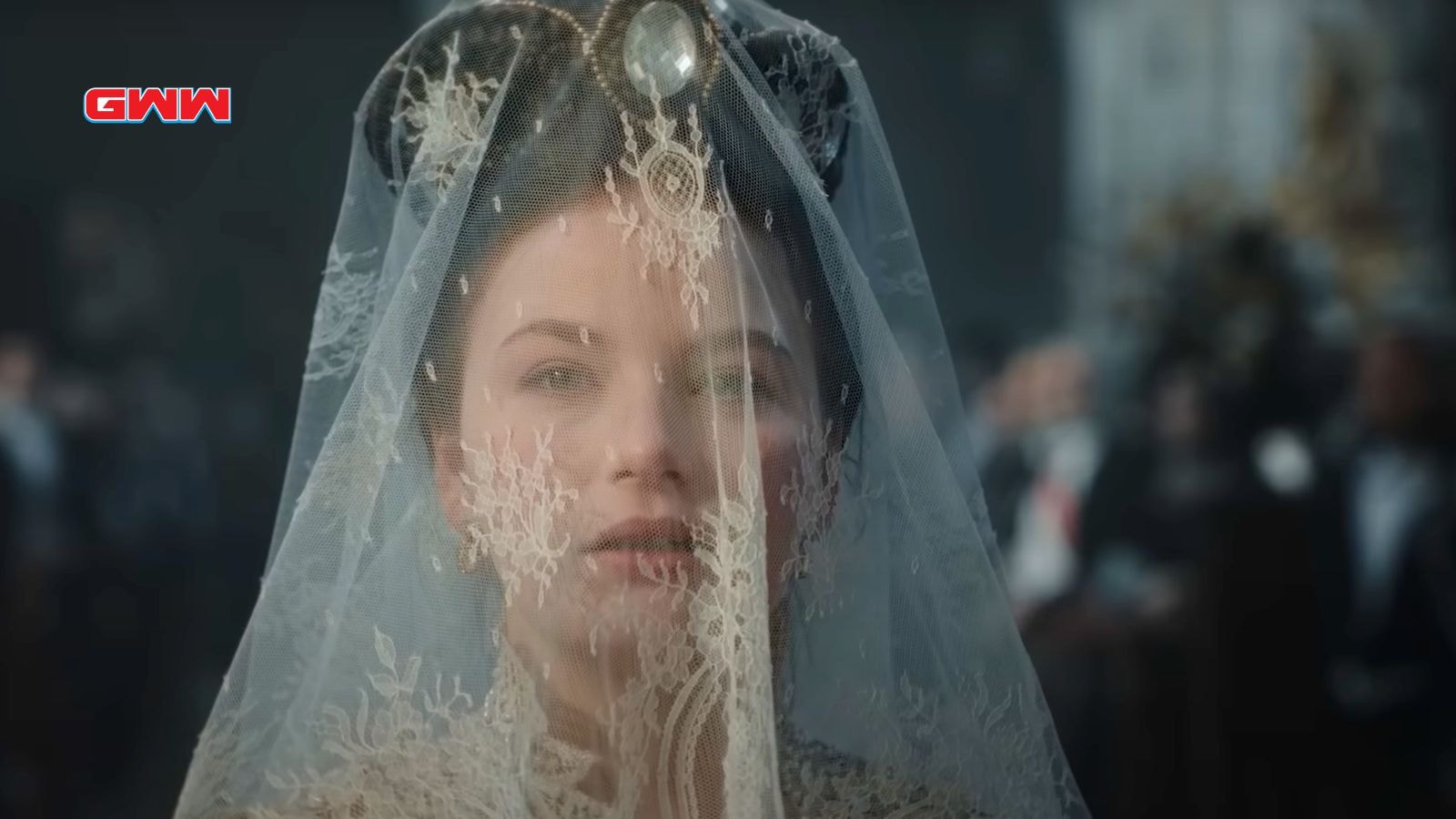 Empress Elisabeth wearing a lace veil during a royal ceremony.