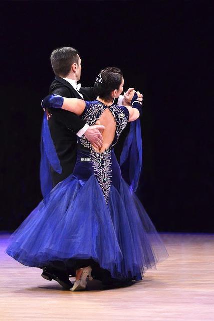 A person and person dancing on a stage

AI-generated content may be incorrect.