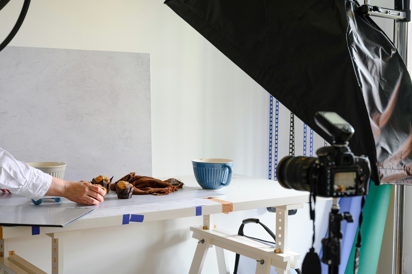 A person taking a photo of food on a table.