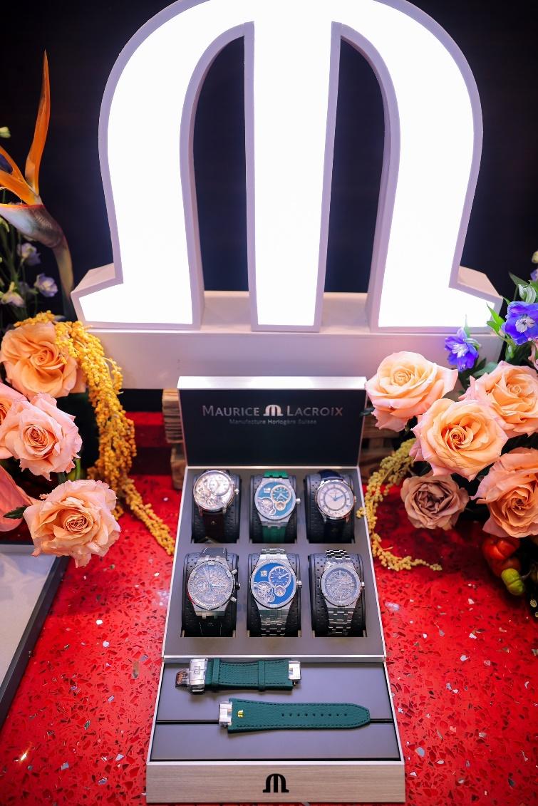 A box of watches with flowers

Description automatically generated