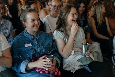 A group of women laughing

Description automatically generated