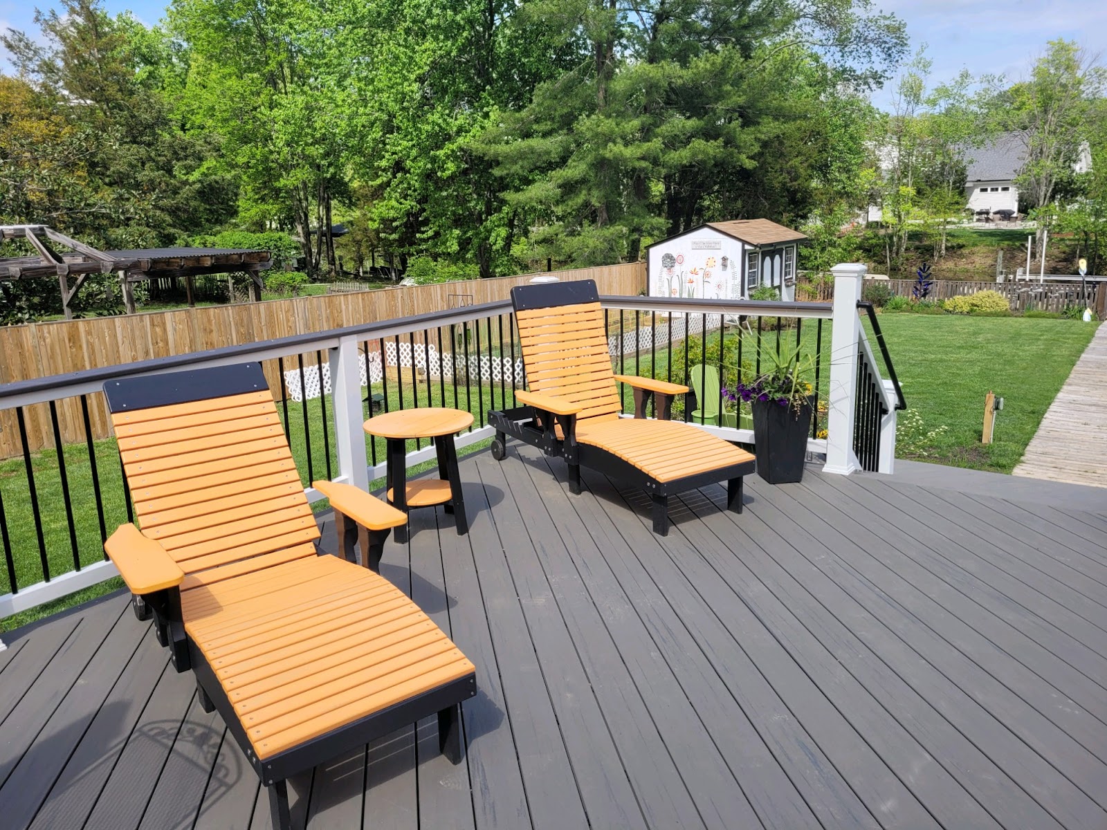 dark wood deck with lounge chairs